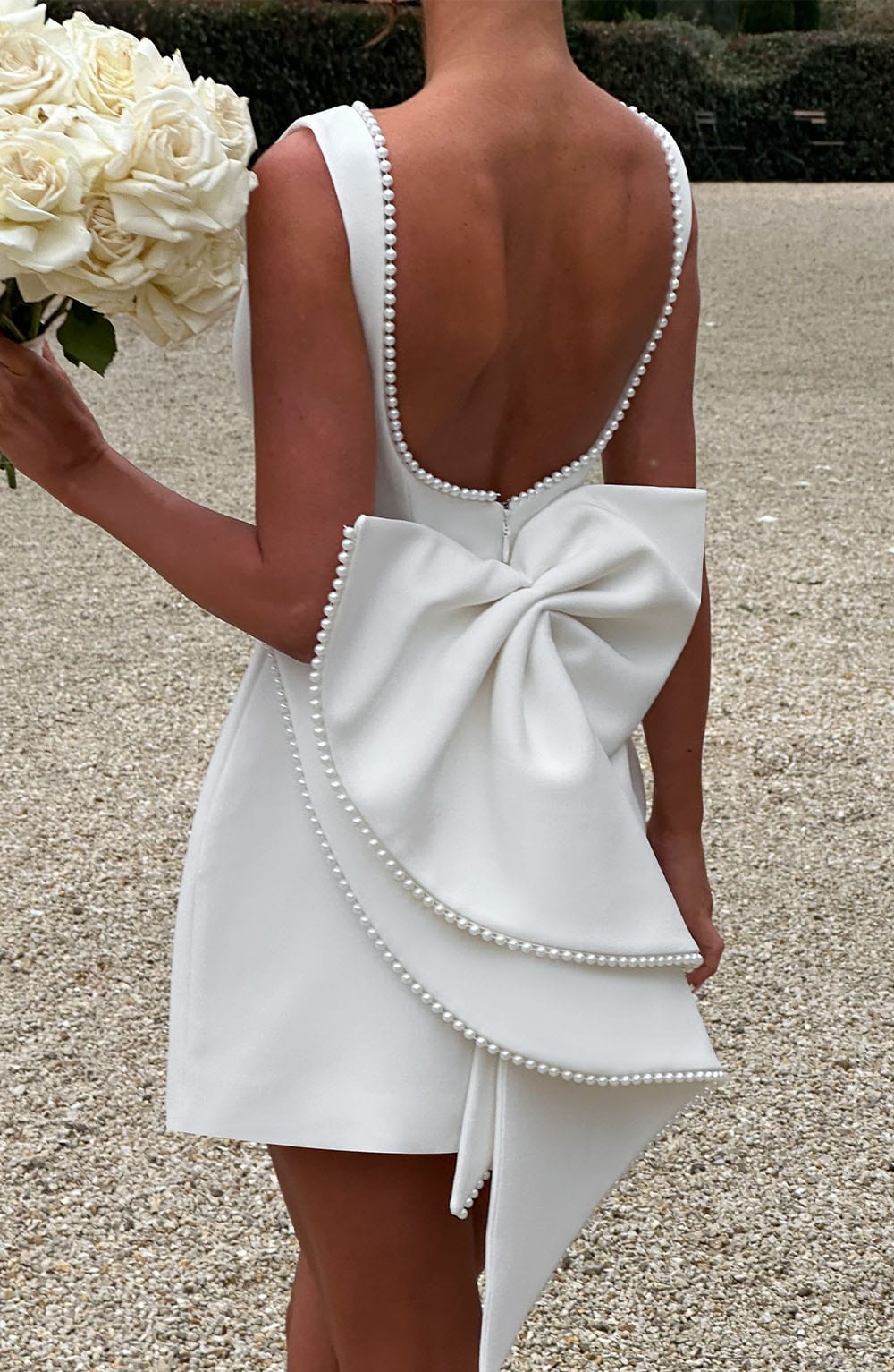 Elegant Pearl Trim Mini Dress for Women with Boat Neck Sleeveless Open Back Bow Detail Cocktail Style