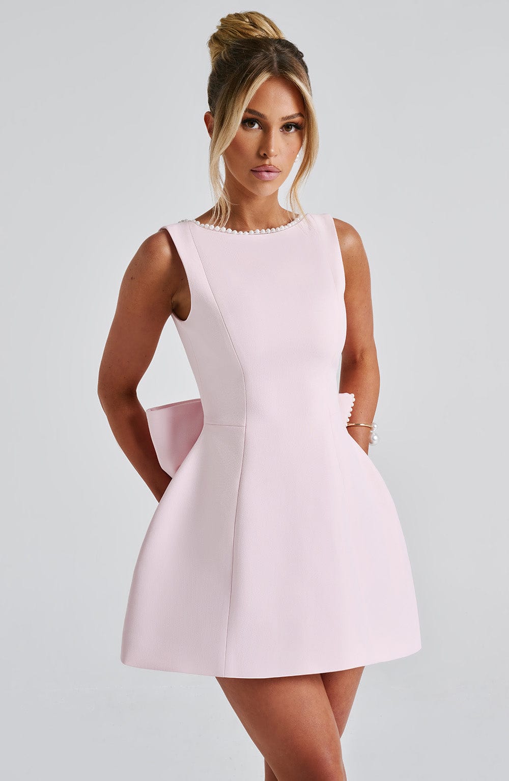 Elegant Pearl Trim Mini Dress for Women with Boat Neck Sleeveless Open Back Bow Detail Cocktail Style