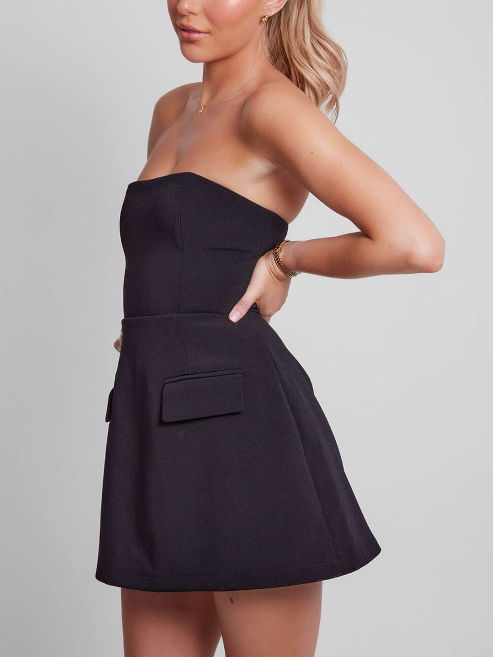 Elegant Structured Mini Dress for Women with Strapless Fit and Flare Pocket Detail Cocktail Style