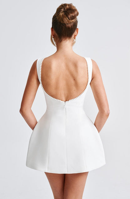 Elegant Pearl Trim Mini Dress for Women with Boat Neck Sleeveless Open Back Bow Detail Cocktail Style
